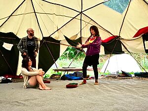 Three people in conversation together